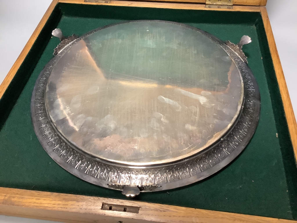 A Victorian engraved silver presentation salver by John Edward Bingham, Sheffield, 1885, width 35.6 cm, 32 oz, in oak box.